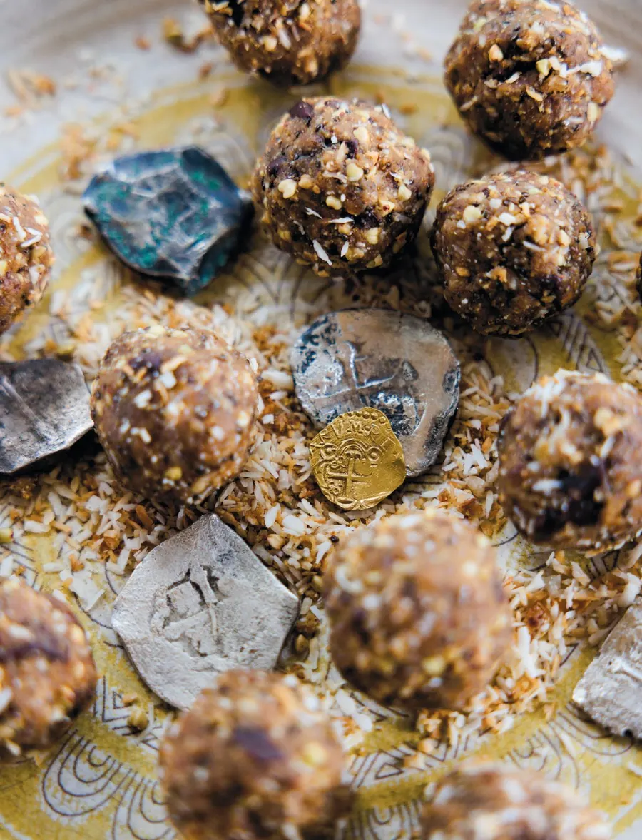 Protein balls beside old Spanish coins